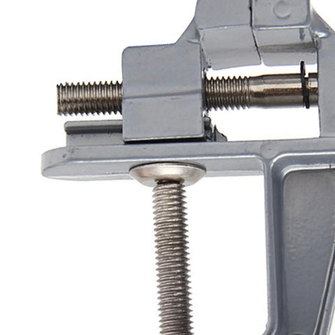Close-up of Rock Solid Mini Bench Vise clamp mechanism showing heavy-duty steel construction for woodworking and lathe jobs.