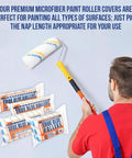 Man holding Pro Grade Premium Microfiber Paint Roller Covers 18 Inch For All Surfaces Refill Bulk Pack Three Eighths Inch Nap