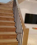 Flat Base Baluster Shoes For Half Inch Square Railings With Screws Satin Black Finish Set Of 30 on wooden stairs.