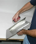 Person using Masonry Hawk With 13 Inch Aluminum Blade And DuraSoft Handle, callus preventer for plaster mud and mortar.