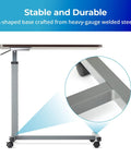 Height Adjustable Overbed Table With Straight Up Sturdy L Shaped Welded Steel Base and smooth rolling precision lock casters close-up of base.