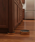 Round Furniture Sliders Three Point Five Four Inch PEVA Pads For Hardwood Tile And Laminate Floors placed under cabinets