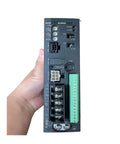 Hand holding BLED6C Motor Controller Industrial Motion Drive for Automation Equipment with Precise Speed and Position Control