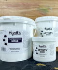 Artists Gesso Primer For Acrylic Painting White 1 Gallon containers with labels on wooden background