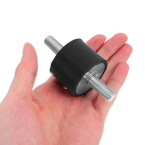 Four Piece Built For The Grind Anti Vibration Rubber Studs M10 Double Screw Mounts in hand showing cylindrical design.