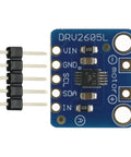 Close-up of Dope Tiny Motor Driver Module Buzzer And Vibration Controller Board for haptic feedback, 18mm size, DRV2605L chip visible.