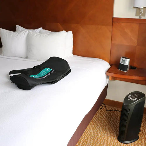 Replacement Air Filter For T500 Tower Air Purifier on a bed, showcasing the purifier and filter bag