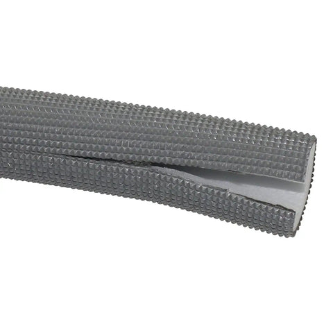 Close-up of gray pipe insulation tubing end with textured surface. Pipe Insulation Tubing 1 Inch By 3 Eighth Inch Heat Preservation Insulated 6 Foot Length Two Handle Grips All Black Great For Hot Or Cold Pipes Reduces Noise And Energy Loss While Softening And Protecting Pipes.