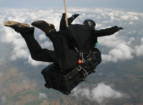 Skydiver carrying 1650 Hard Case With Customizable Pick N Pluck Foam, Waterproof And Bombproof Gear Storage