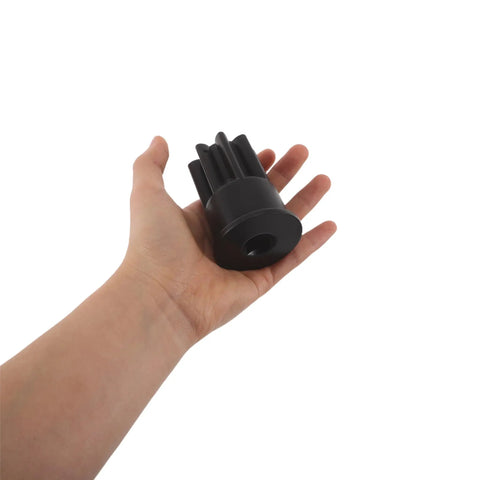 Hand holding a Dual End Engine Barring Socket Wrench Shop Tested For Cat 3200 And 3406 Series Engines, showing solid black material.