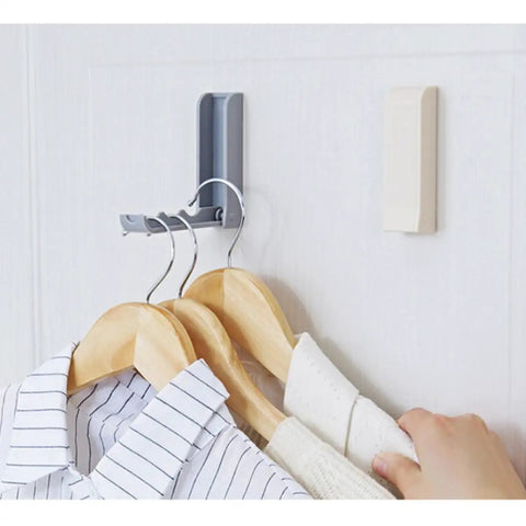 Slick Foldable Wall Hooks With Adhesive Backing For Space Saving No Drill Setup To Hang Jackets Purses Hats Or Dog Leashes In Foyer Closet Easy Install Design Works As A Lifesaver To Keep Home Clutter Free Always Two Pack on wall with hanging clothes.