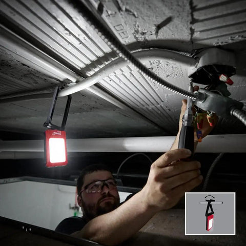 Electrician using Low Profile Magnetic Task Light With Three Modes High 500 Lumens Medium 250 Lumens Low 100 Lumens Magnetic Mount