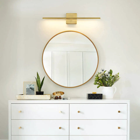 Gold Vanity Light Over Mirror 24 Inch LED 18W over round mirror above white dresser with plants