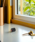 Ultimate Plasma Cutter Start Cartridge Replacement For Thermal Cutting Torch on a desk next to a gold pen.