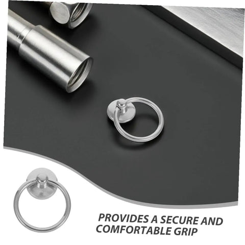 Close-up of a silver metal ring drawer pull on a countertop, part of Ten Pack Silver Metal Ring Drawer Pulls With Single Hole Vintage Style Drop Ring Knobs For Dressers And Cupboards Built To Last Durable Cabinet Handles Great Diy Upgrade For Furniture Hardware Accessories.