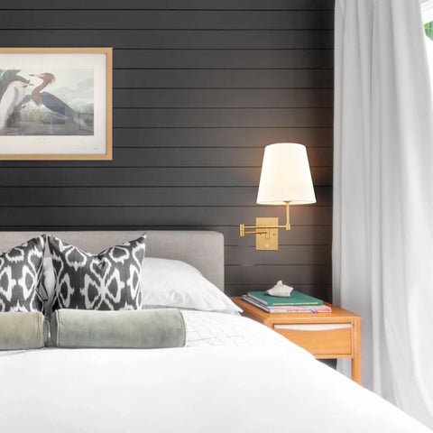 Gold Swing Arm Wall Lamp With Brass Finish And Linen Shade in bedroom setup, modern farmhouse sconces.