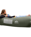 Woman relaxing on Wekapo Inflatable Lounger Couch Portable Air Sofa Chair For Camping Beach Hiking Lawn Backyard And Outdoor Festivals Pump Free No Pump Needed Air Hammock With Airtight Seal And Cozy Pillow Shaped Headrest For Chill Vibes.