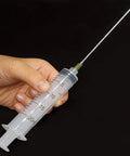 Three Pack 20 Milliliter Plastic Syringes With Slick Blunt Luer Lock Needles For Precision Liquid Transfer Heavy Duty Build, held in hand.