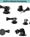 Assorted GoPro camera accessory mounts and screws on white background