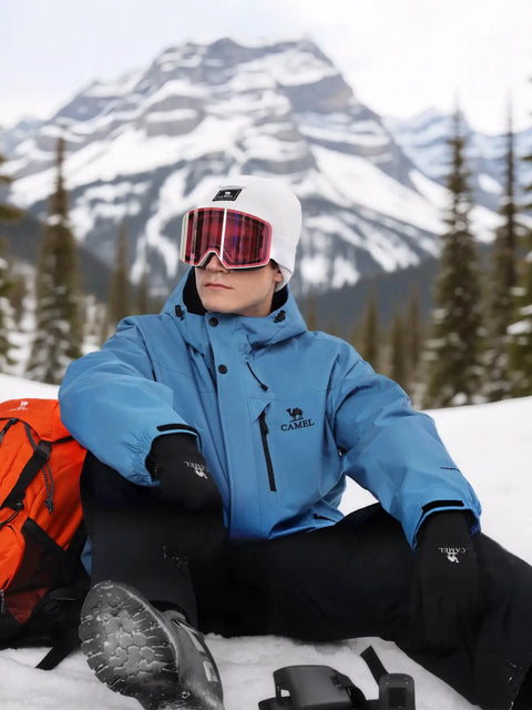 Man wearing Men's Winter Ski Jacket Waterproof Snow Coat With Windproof Hood And Warm Fleece Lining, seated in snowy mountains