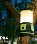 Beast Bright 3000 Lumen Rechargeable Lantern With 5 Light Modes, IP54 Waterproof, hanging on a tree at night in the rain, green.