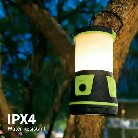 Beast Bright 3000 Lumen Rechargeable Lantern With 5 Light Modes, IP54 Waterproof, hanging on a tree at night in the rain, green.