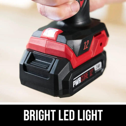 Close-up of bright LED work light on Compact Brushless Hammer Drill Kit with 12V Power Core, showing PWR CORE 12 battery pack