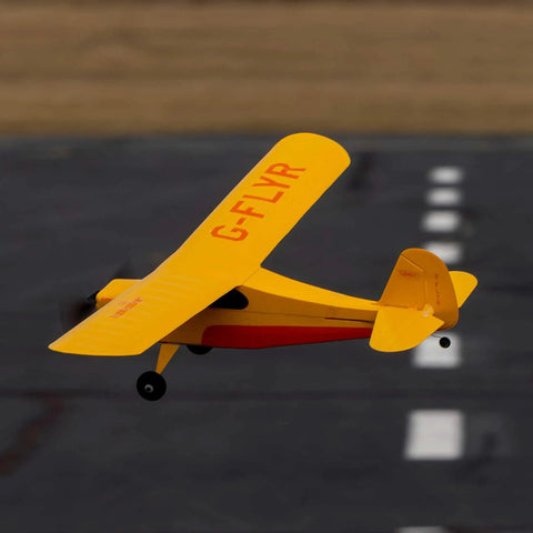 Champ Anniversary Edition 515mm RC Trainer Airplane BNF Basic With Safe Select Ready To Fly Factory Preassembled 25th Anniversary Celebration Model For Beginners And Hobbyists in flight over runway