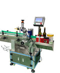 Heavy Duty Automatic Labeling Machine For Honey And Juice Bottles With Plug And Play Filling Capping System, with control panel and bottles.