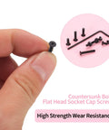Top Shelf M2.5 Metric Screw Assortment Kit Featuring 1110 Pieces Of Black Countersunk Hex Socket Cap Bolts And Nuts Set With Washers And Wrench Built Tough For Anything, held in hand.