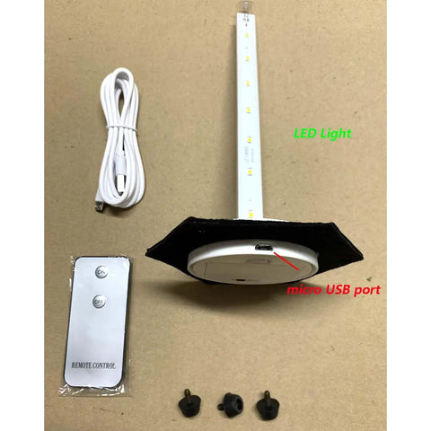 Components of Lighthouse Tiffany Style Stained Glass Accent Table Lamp including remote, USB cable, and LED base.