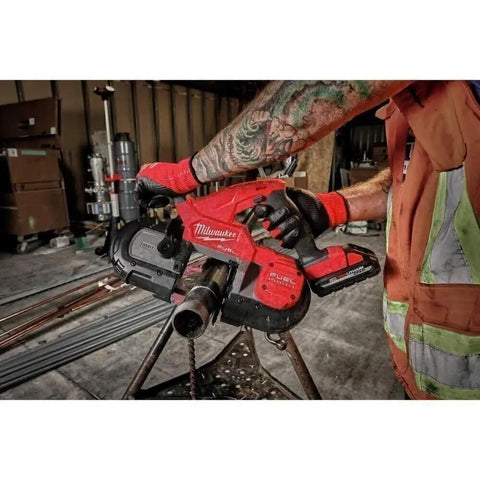 Worker using Ultra Light 18V Cordless Band Saw With Brushless Motor And Constant Power Tech Delivers The Fastest Cuts In Its Class For Portable Tough Jobs On The Jobsite, No Hype for cutting pipe
