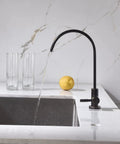 Real Deal Oil Rubbed Bronze Drinking Water Faucet For Reverse Osmosis Systems With Non Air Gap Design And Lead Free 304 Stainless Steel Construction delivering smooth flow over a sink.