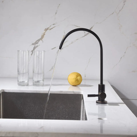 Real Deal Oil Rubbed Bronze Drinking Water Faucet For Reverse Osmosis Systems With Non Air Gap Design And Lead Free 304 Stainless Steel Construction delivering smooth flow over a sink.