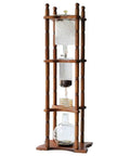 Big Batch Cold Brew Coffee Maker With Adjustable Stainless Steel Dripper And Roomy Borosilicate Glass Carafe, wooden stand and glass carafe.