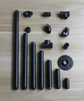 Assorted black steel pipes and fittings set for Six Pack Three Quarter Inch By Eight Inch Black Metal Pipe Pre Cut For Industrial Shelving And Home Decor.