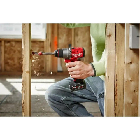M12 Fuel Cordless Hammer Drill Kit Delivering Knockout Torque And Slick Grip Handling Crushes Through Concrete And Lumber Like Badass Power Perfect For Pro Grind Days And Weekend Workshops Requiring Zero Hassle Maximum Reliability in use, drilling through wood.