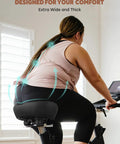 Woman on bike with Extra Wide Comfort Bike Seat For Men And Women Pain Free Rides With Ergonomic Design And Ventilation Holes