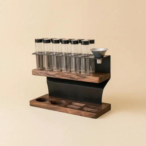 Heavy Hitter Coffee Bean Storage Rack With Twelve Clear Glass Bottles And Solid Wood Base in a modern design with a funnel.