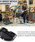Mechanic using Bike Repair Stand With Magnetic Tool Tray And Four Compartment Organizer in workshop, close-up of tray installation.