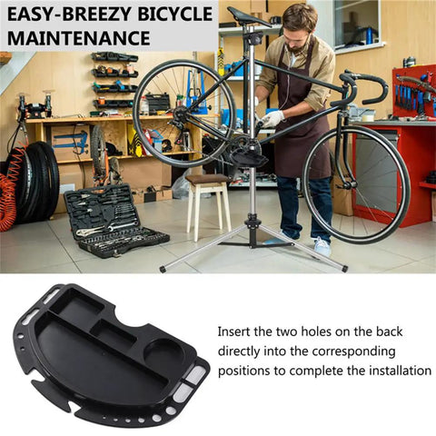 Mechanic using Bike Repair Stand With Magnetic Tool Tray And Four Compartment Organizer in workshop, close-up of tray installation.