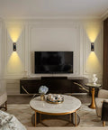 Interior view with up and down dimmable LED wall lights for outdoor use, sleek modern design beside TV, 3000K warm white light.