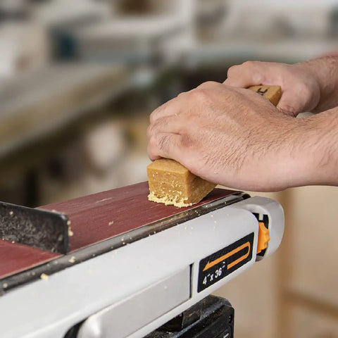 Pro Grade Abrasive Cleaning Stick for Sanding Belts and Discs, 8-1/2 Inch Natural Rubber Eraser cleaning a sanding belt