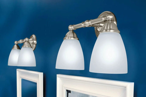 Brantford Style 2-Light Dual-Mount Vanity Light In Brushed Nickel With Frosted Glass on blue wall above mirror