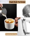 Stainless Steel Milk Frothing Pitcher 12oz 350ml With V Sharp Mouth For Latte Art Barista Ready Milk Jug Cup For Cappuccino Latte Macchiato Pro Grade Pouring Rust Proof Easy Clean Decorating Pen Included seen pouring milk into a cup with latte art design.