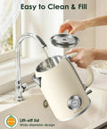 1.8L Electric Kettle With Temperature Gauge, 1500W Fast Boil, 304 Stainless Steel Retro Style Hot Water Kettle With Lit LED Light, Auto Shut Off And Boil Dry Protection shown being filled with water