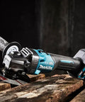 Badass Cordless Angle Grinder Kit Including Dual 40V Max Batteries And Smart Charger For Swift 125mm Metal Cutting Hella Lightweight Yet Serious Powerhouse Tool on wooden surface.