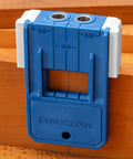 Quarter Inch Doweling Jig Kit With Bit And Stop Collar in use on wood surface showing measurement guide and clamp zone.