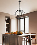 Large Lantern Globe Black Chandelier For Farmhouse Vibe, Four Light Pendant Ceiling Fixture above kitchen island
