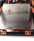Straight Shot 3D Printer Bear Upgrade Kit Built For Prusa i3 Mk3 with heated stainless steel print bed and orange mounting clips.